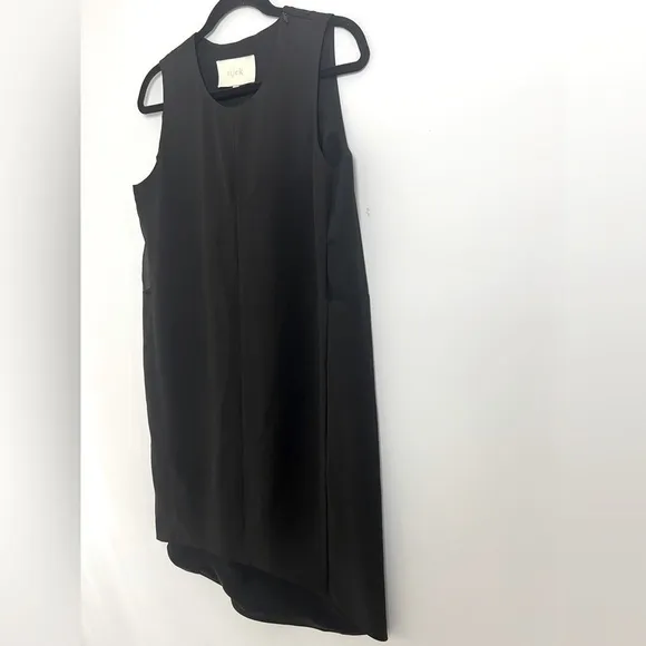 Aijek Black Minimalist Sheer Panel Sleeveless Hi-Lo Hem Knee Length Shift Dress