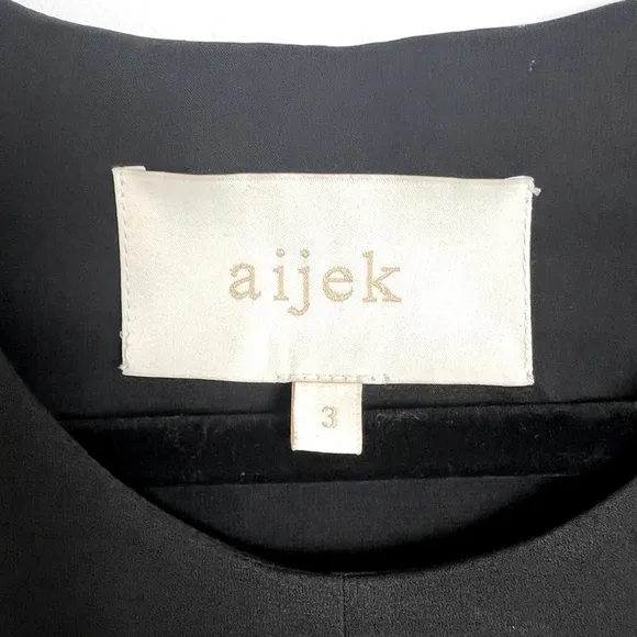 Aijek Black Minimalist Sheer Panel Sleeveless Hi-Lo Hem Knee Length Shift Dress