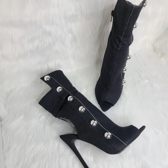 Black boots stiletto heel open toe silver studs.