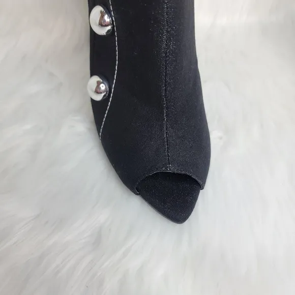 Black boots stiletto heel open toe silver studs.