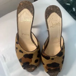 Christian Louboutin Leopard Print Women's Shoes. Heel tips are metal on purpose