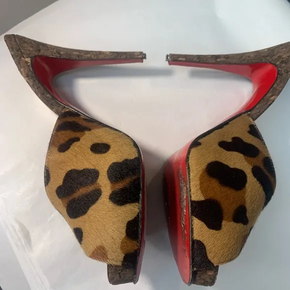 Christian Louboutin Leopard Print Women's Shoes. Heel tips are metal on purpose