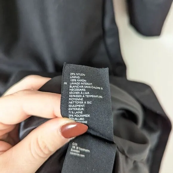 COS black wool blend dropped shoulder barrel sleeve minimalist midi dress