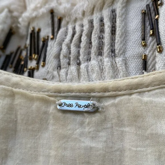 Free People stunning bead embellished dress from luxury boutique in Laguna