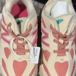 New Balance Cream and Pink Athletic Shoes