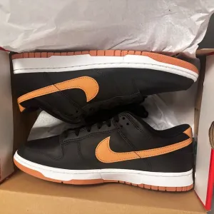 New Nike Dunk Low Retro Men's Black and Tan Sneakers.