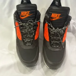 Nike Black and Orange Athletic Shoes with Bold Design
