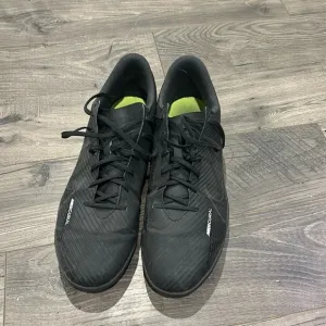 Nike mercurial indoor soccer shoes.
