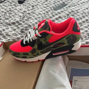 Nike orange and Green Athletic Shoes with Air Max Cushioning