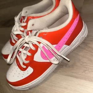 Nike Orange and Pink Sneakers with Bold Design