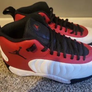 Nike Red and Black Sneakers with Classic Silhouette