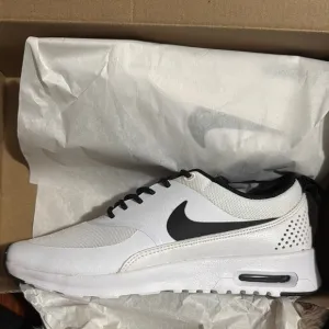 Nike Women’s White and Black Sneakers